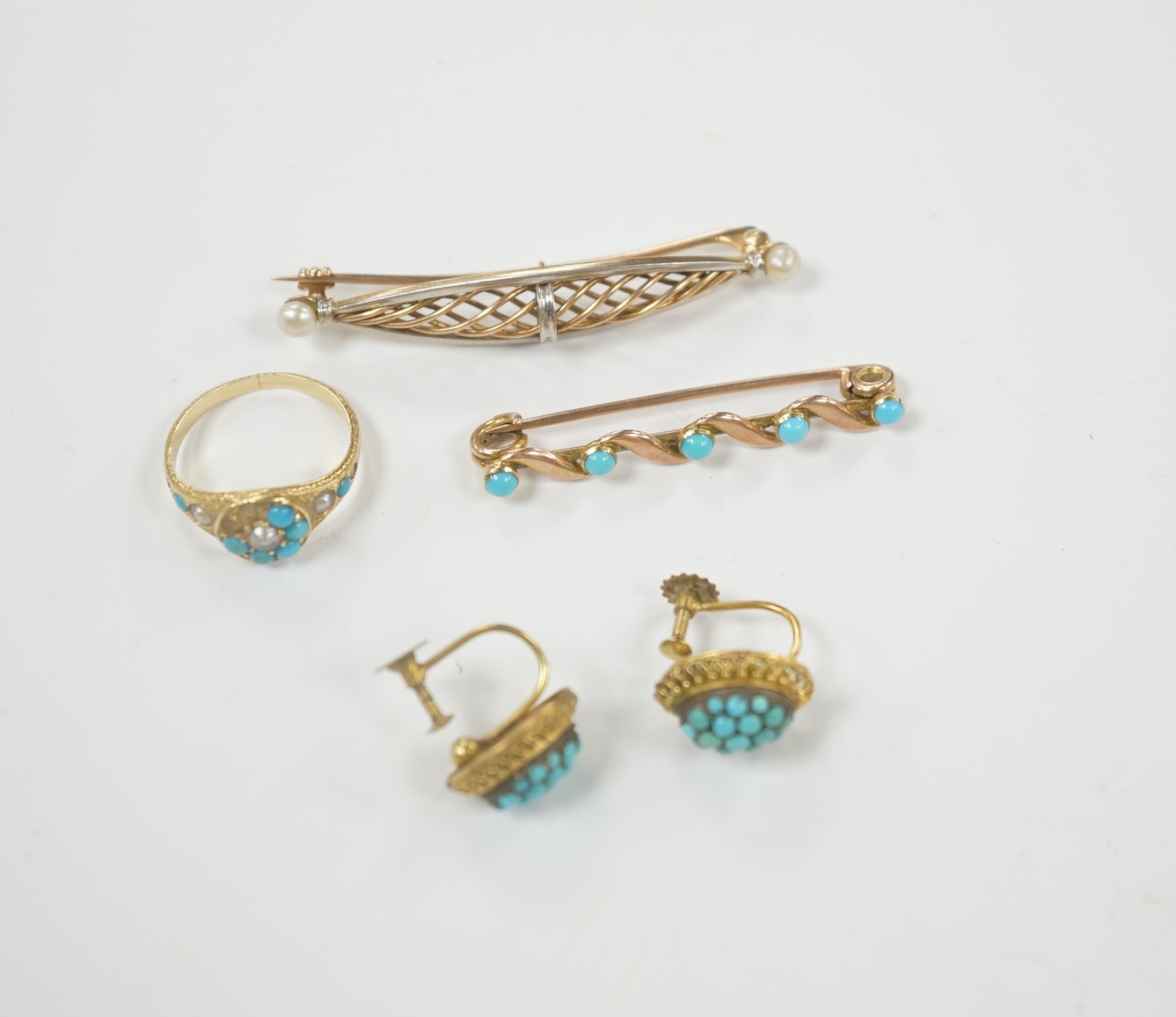 A pair of early 20th century 9ct and turquoise cluster set ear clips, 13mm, together with two yellow metal and gem set brooches and a yellow metal, turquoise and seed pearl cluster set ring (stones missing), gross weight